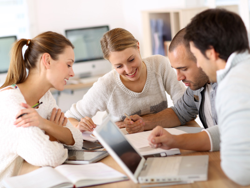 Group of high school students working with a tutor